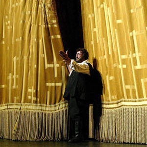 Pavarotti in front of the Met Opera golden silk curtain