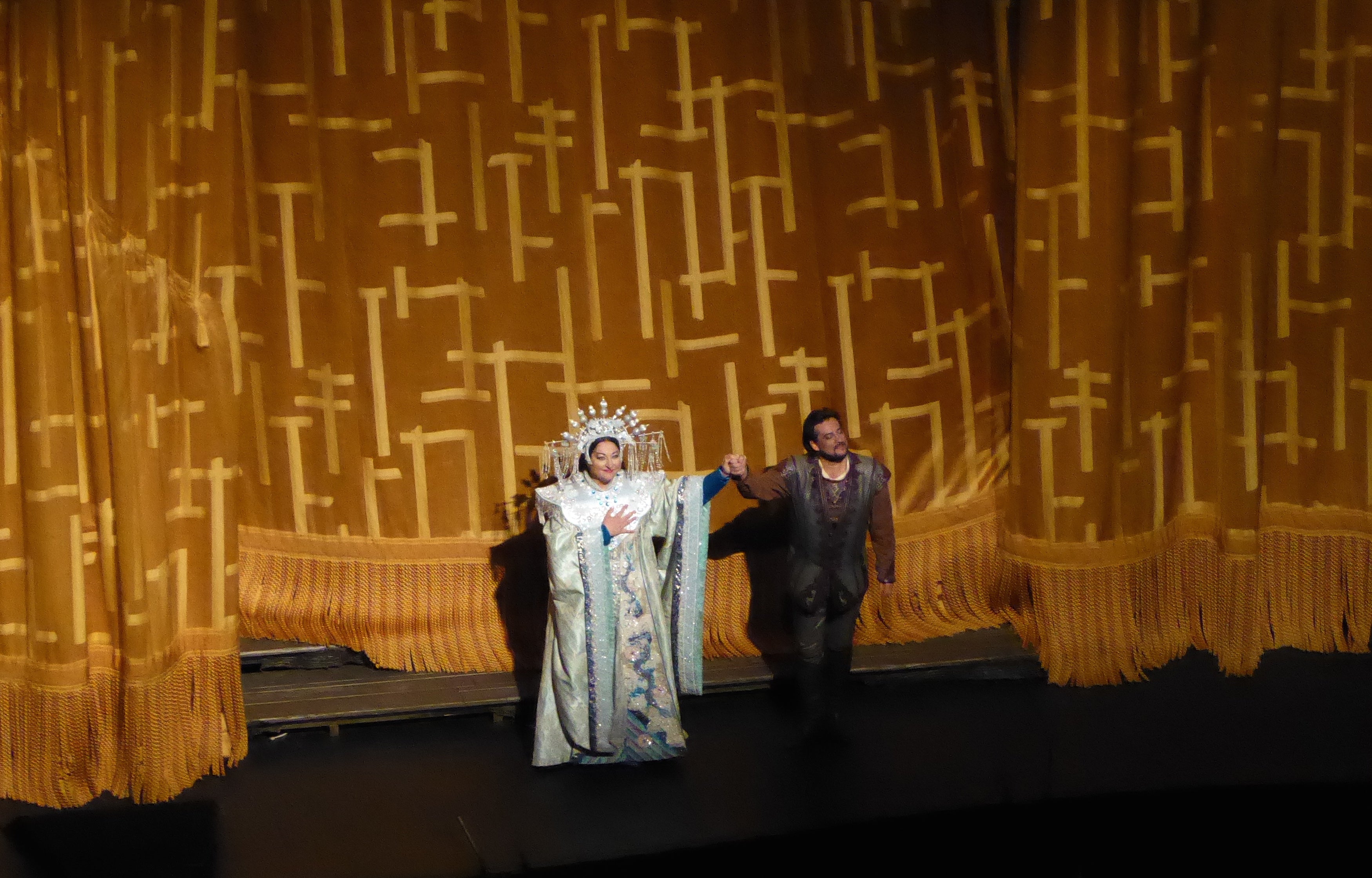 Opera greats, taking a box in front of the golden silk curtain